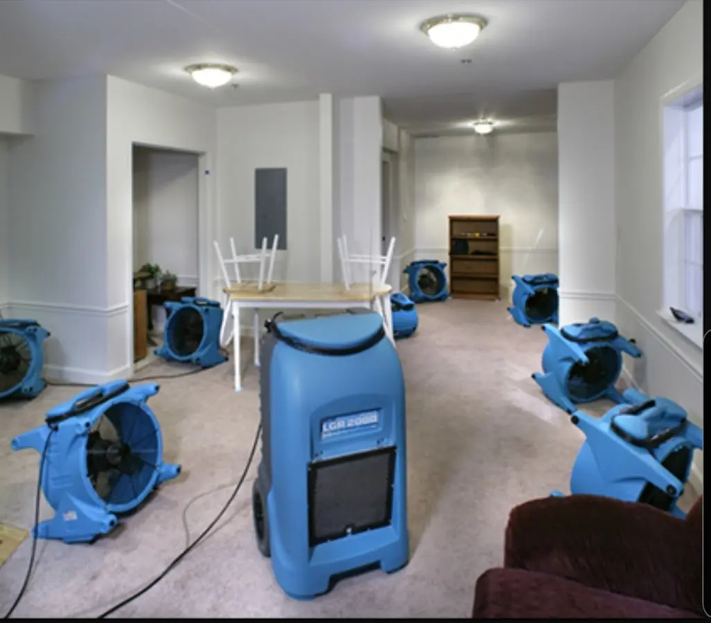 Air movers and dehumidifier setup for Water Extraction & Removal in Stanford